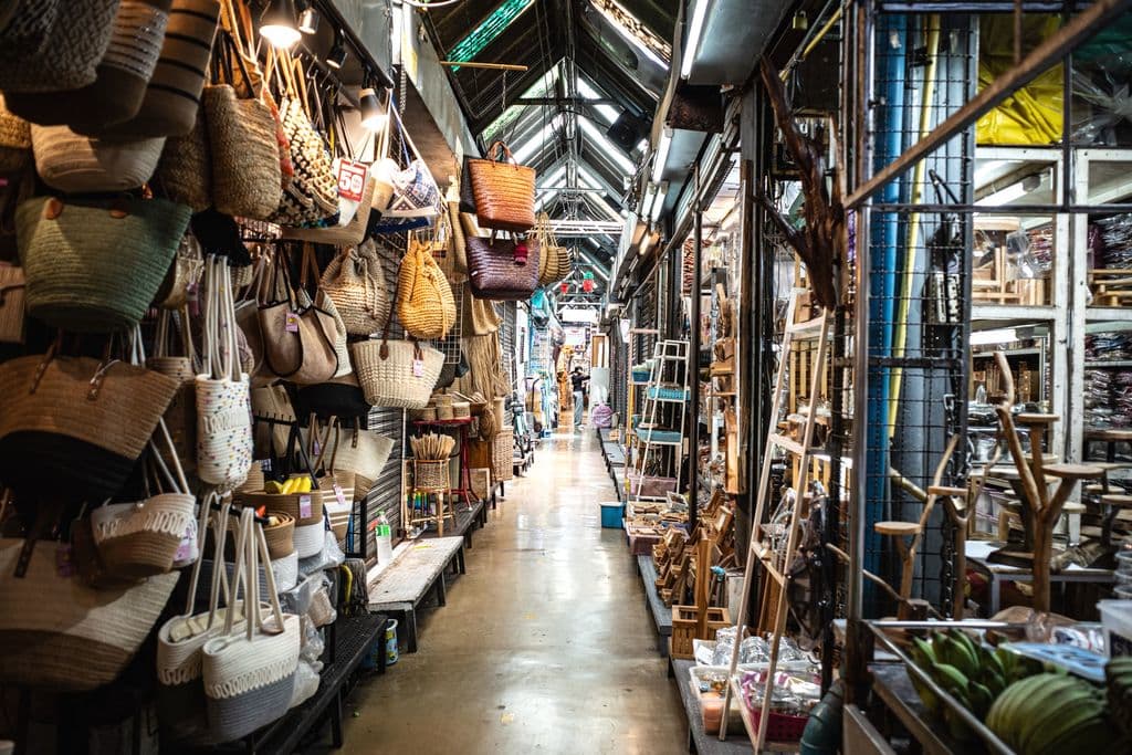 Busy aisle inside Chatuchak Weekend Market in Bangkok, by World Edits