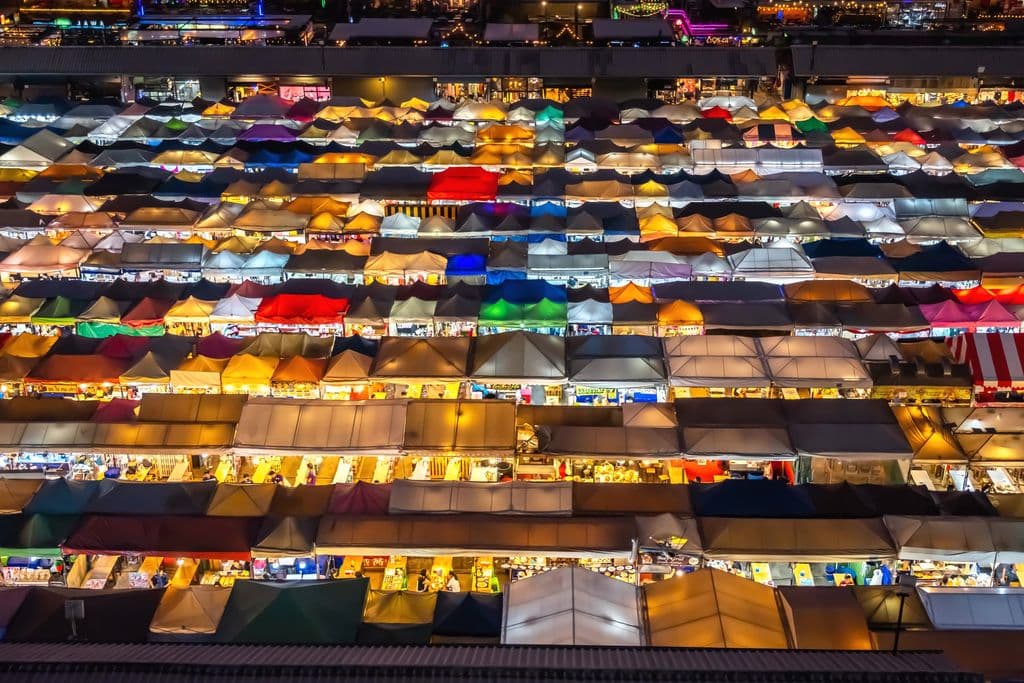 Colorful Bangkok night market stalls from above, by Ahmet Çığşar