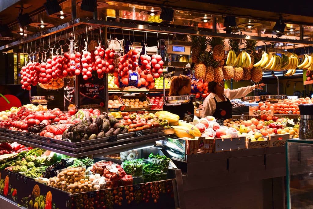 Colorful fruit stand in La Boqueria Market in Barcelona, by AXP Photography