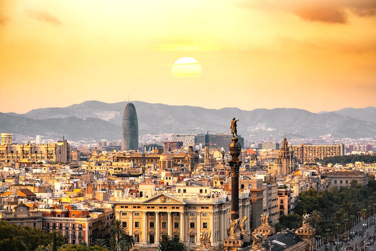 Golden-hour Barcelona skyline with Torre Glòries, by Aleksandar Pasaric