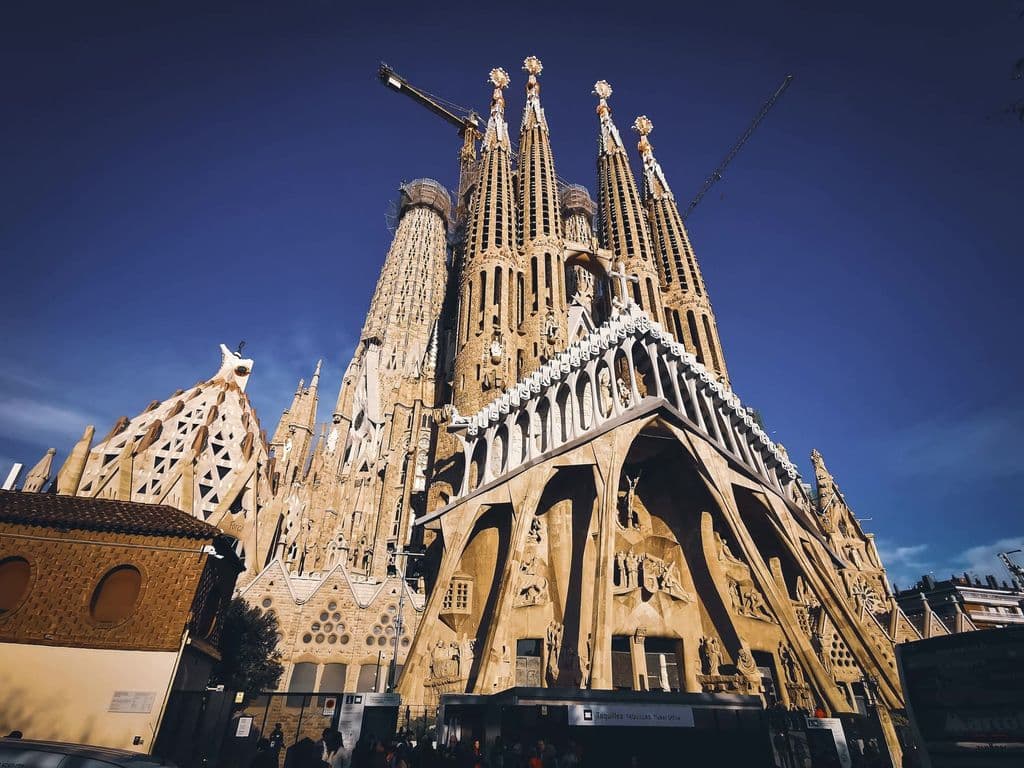 Low-angle exterior of Sagrada Familia in Barcelona, by Mehmet Turgut Kirkgoz