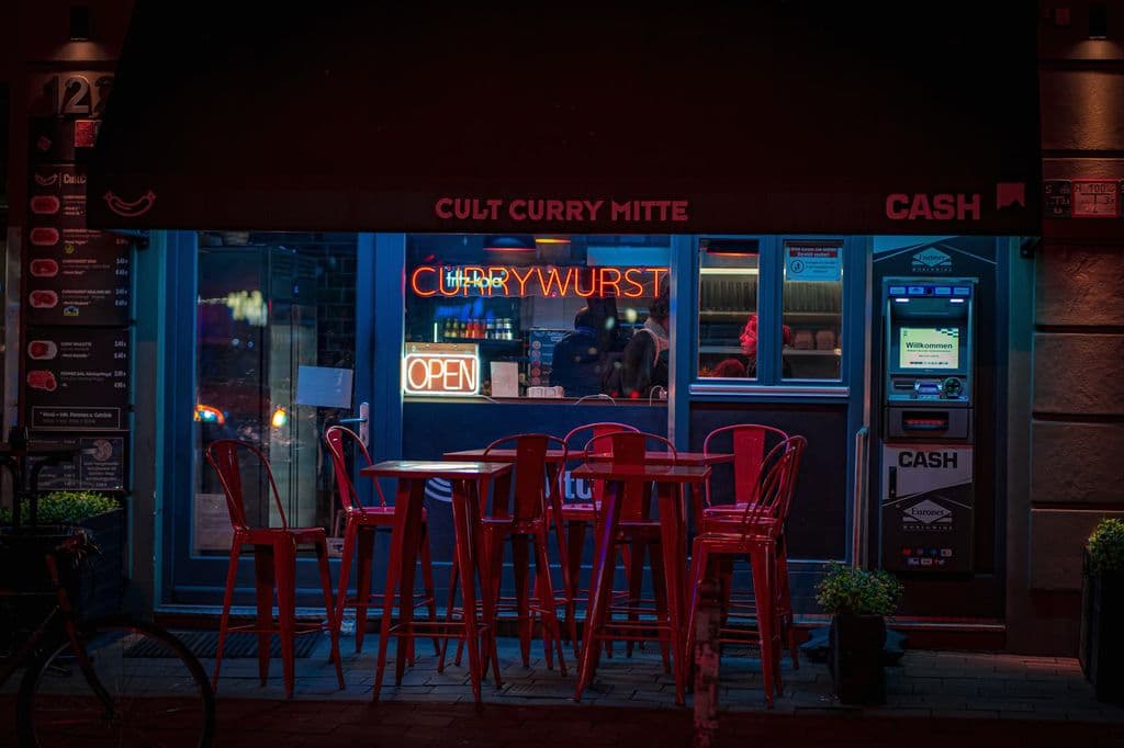 Berlin currywurst restaurant at night, by Annika Rose