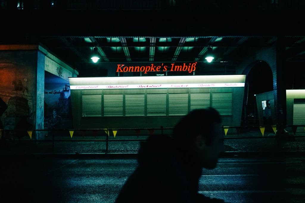 Konnopke’s Imbiss in Berlin at night, by Matias Mango