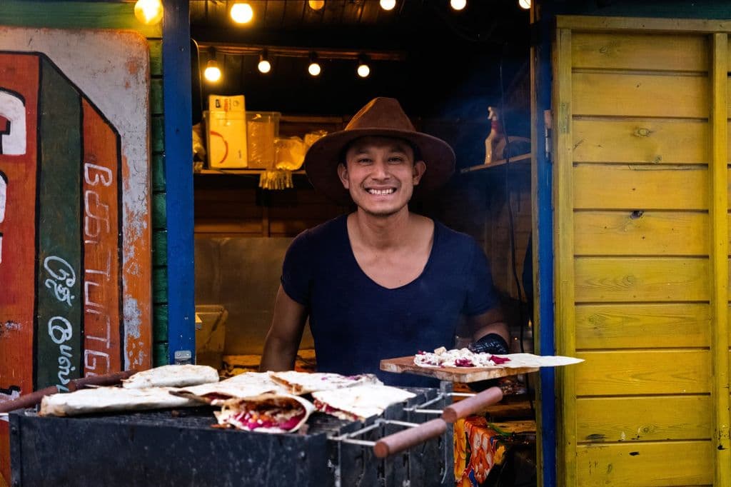 Street food vendor at an outdoor market in Berlin, by Felipe Souza Melo