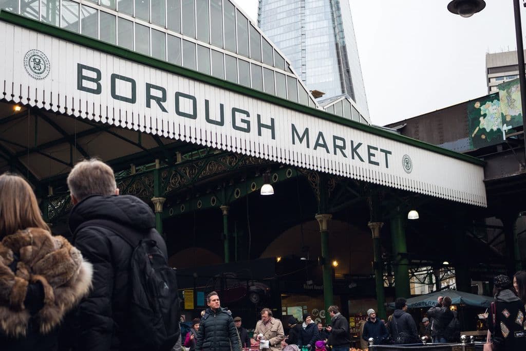 Crowds and stalls at Borough Market in London, by Dom J