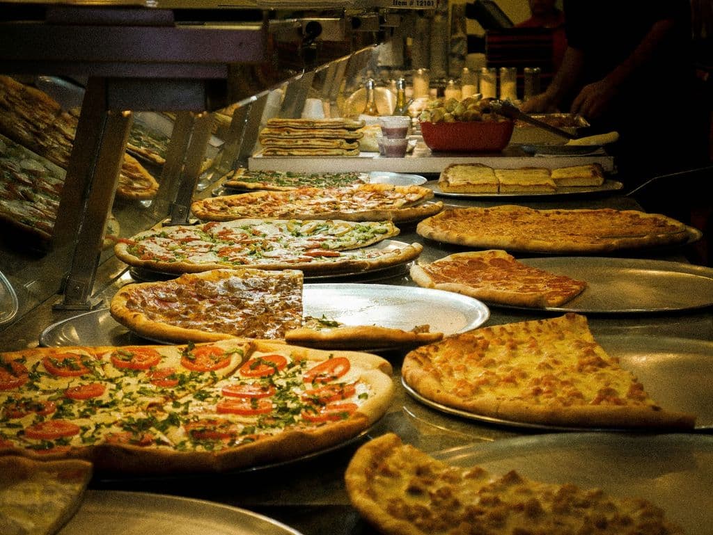 Pizzas on trays, photo by Diego Marín