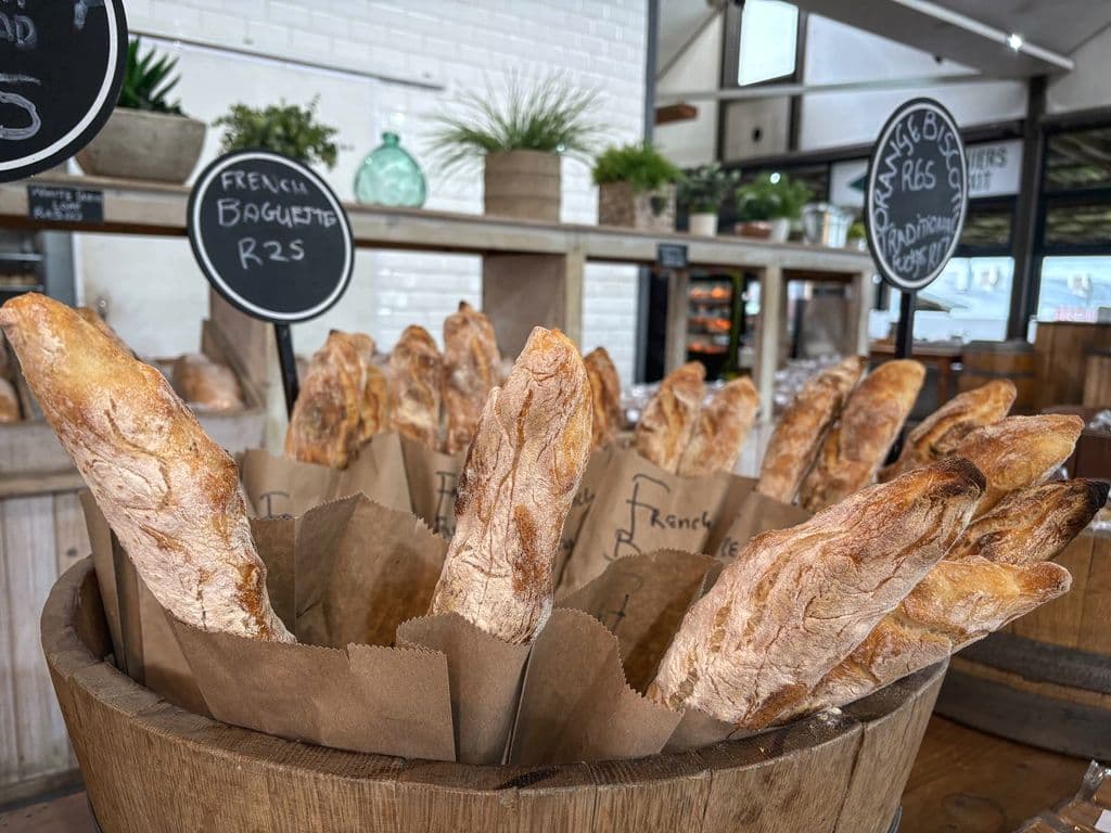 Fresh baguettes in a bakery, by Magda Ehlers