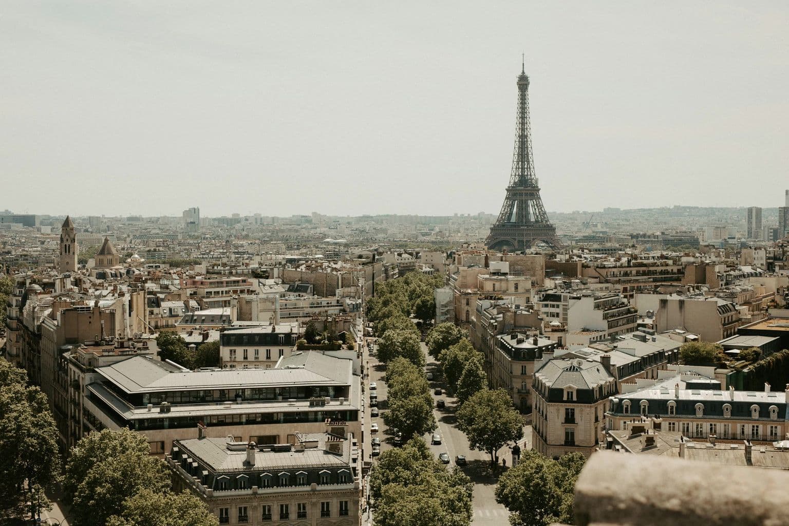 Eiffel Tower above the Paris cityscape, by Calvin Craig