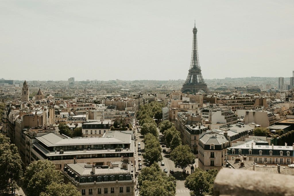 Eiffel Tower above the Paris cityscape, by Calvin Craig