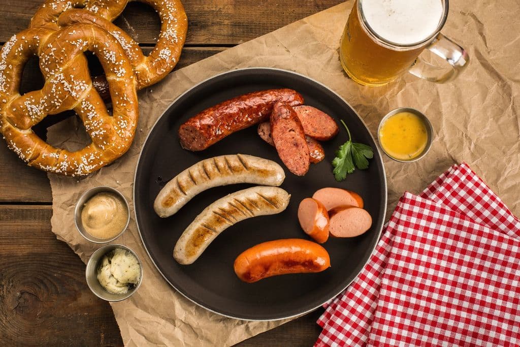 German bratwurst with pretzels, dips, and beer, by tom davis