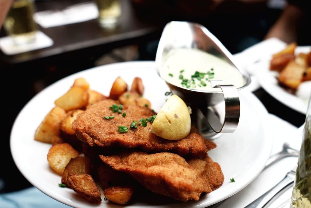 German schnitzel with roasted potatoes and lemon, by Zhang Thomas