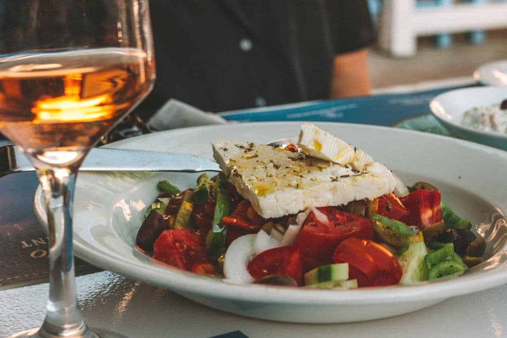 Greek salad with tomatoes, cucumber, olives, and feta, by Loes Klinker
