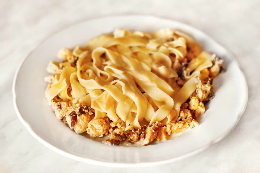 Greek pastitsio-style baked pasta served on a plate, by Julia Prestige
