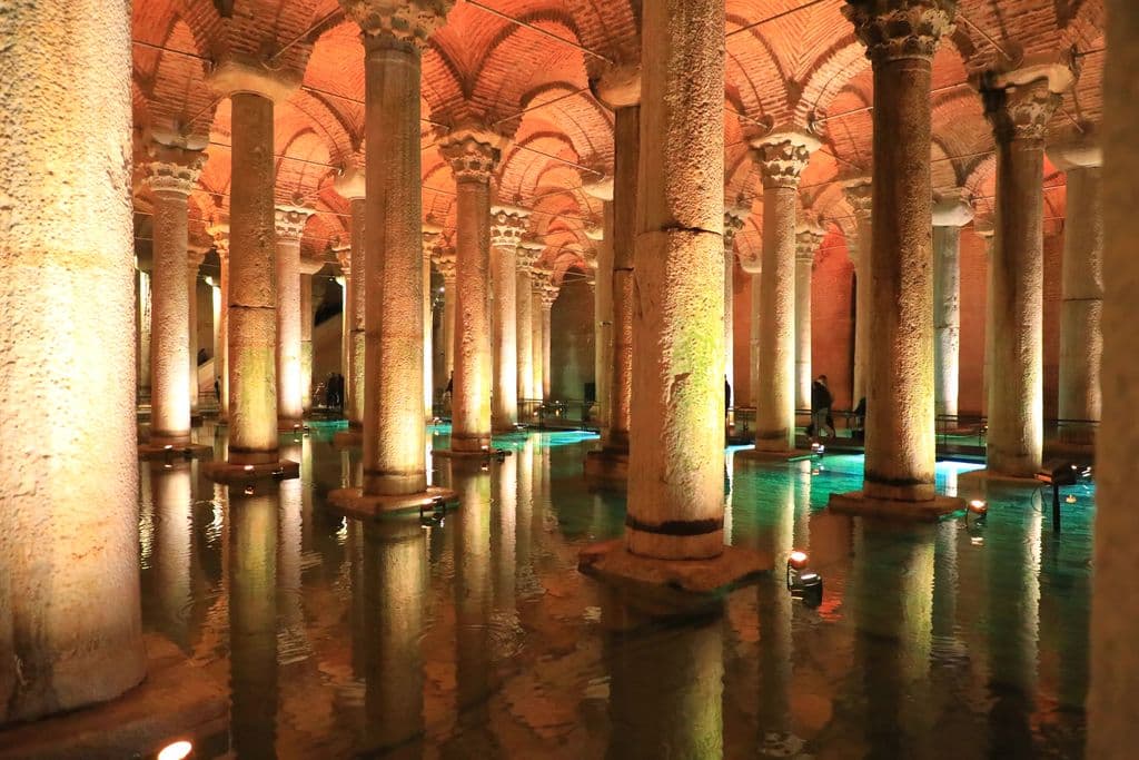 Illuminated Basilica Cistern arches and reflections in Istanbul, by MEHMET SÜTLAŞ
