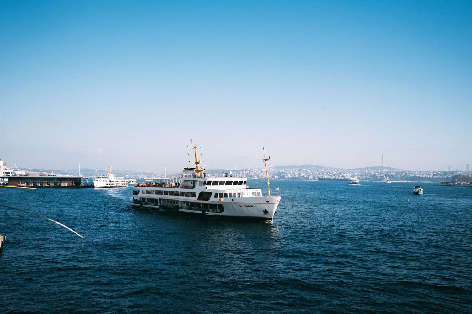 Ferry on the Bosphorus with Istanbul skyline, by Sami TÜRK