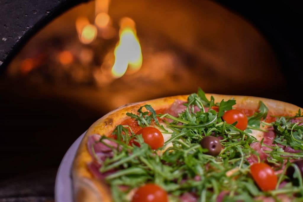 Pizza Napoletana served as traditional Italian food, by Jovan Popović