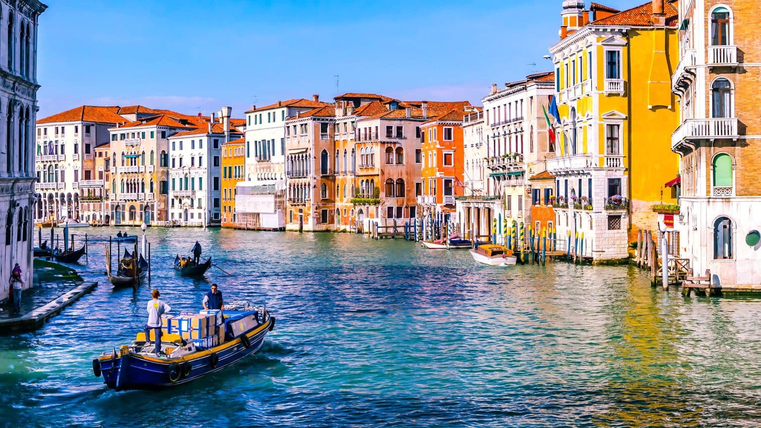 Venice Grand Canal with colorful waterfront buildings in Italy, by Kit Suman