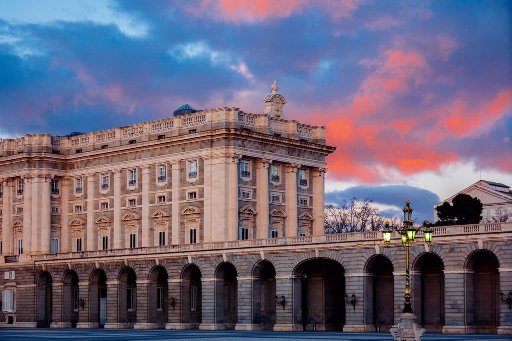 Royal Palace of Madrid with a colorful sunset sky, by Alex Does Pictures