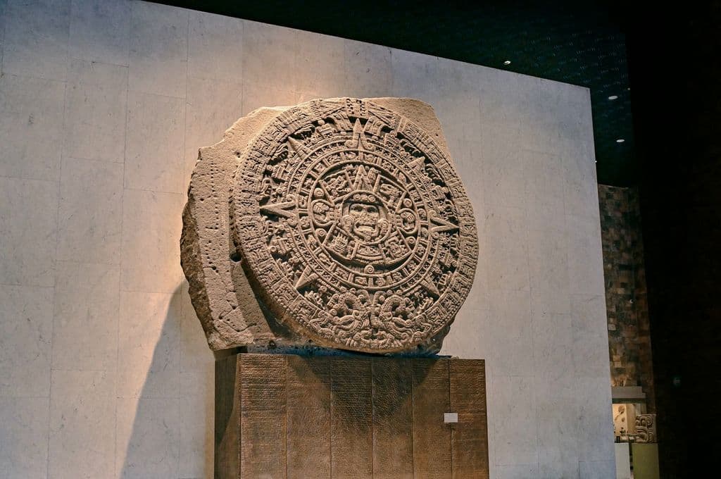 Aztec Sun Stone display at the National Museum of Anthropology in Mexico City, by Girl with red hat