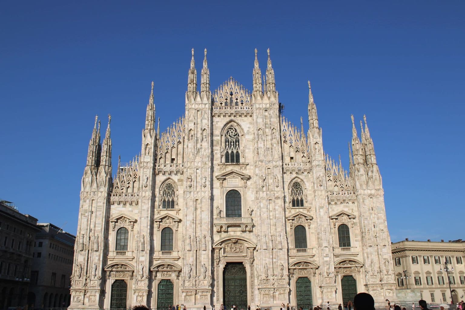 Milan Cathedral and Piazza del Duomo under clear blue sky, by Earth Photart
