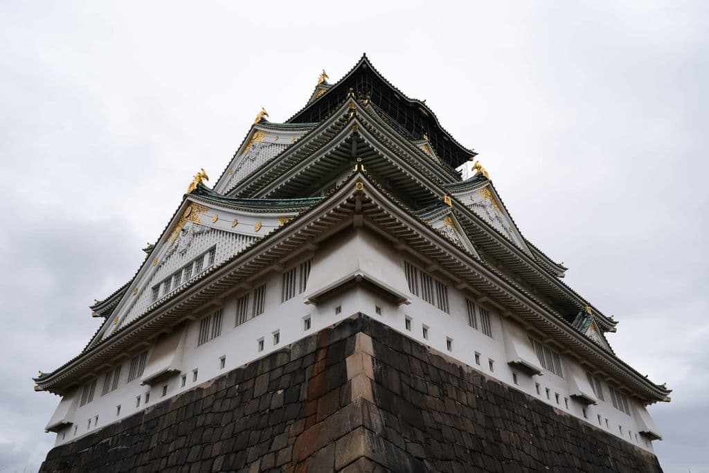Osaka Castle surrounded by trees, by Dmitry Romanoff