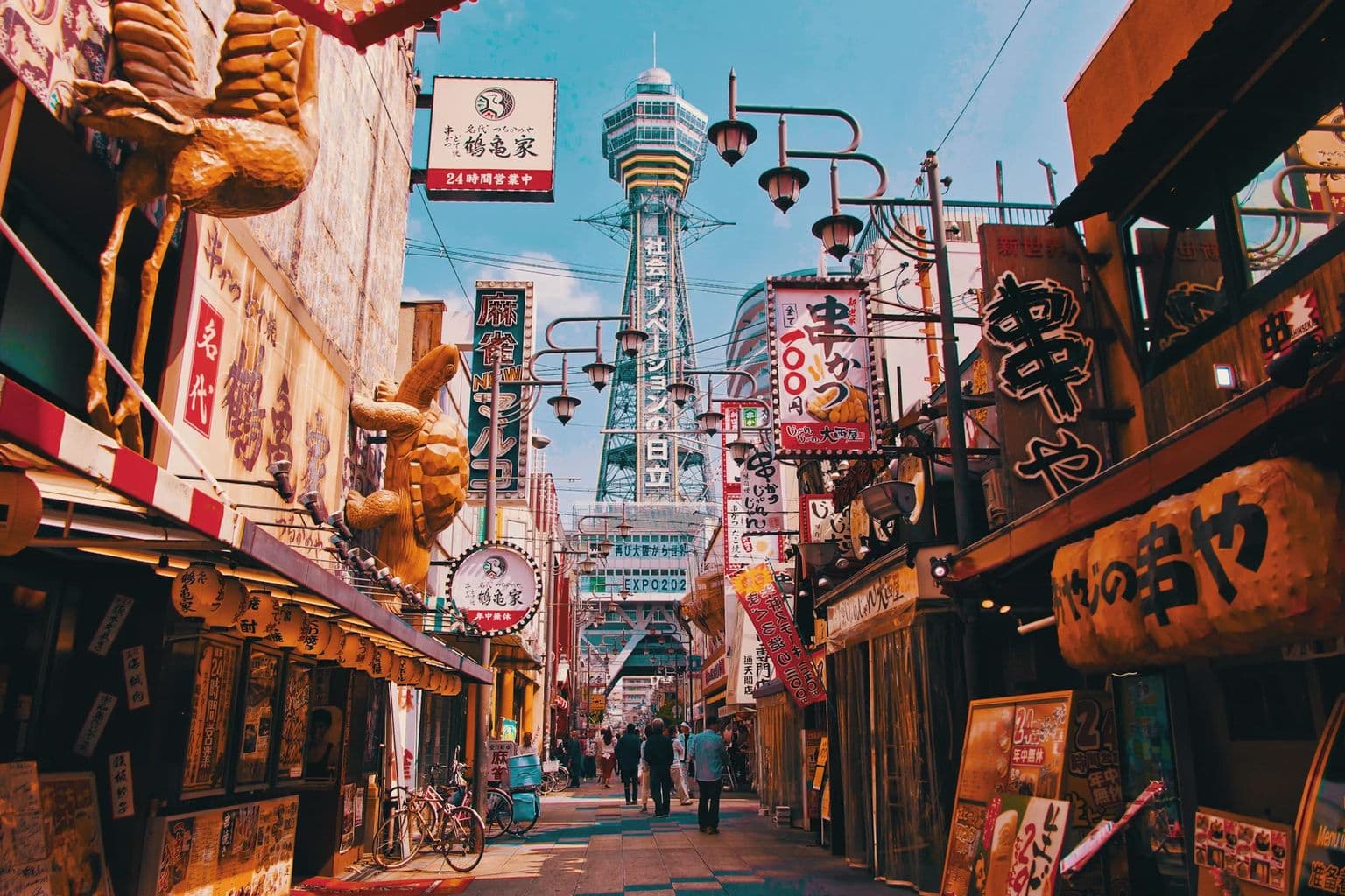 Dotonbori lights and city signs in Osaka, by Unsplash