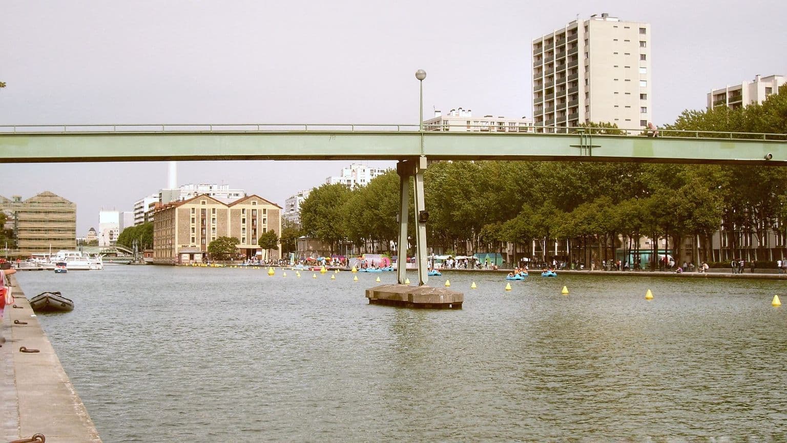 Canal Saint-Martin with green bridge and water in Paris, by Ryszard Zaleski