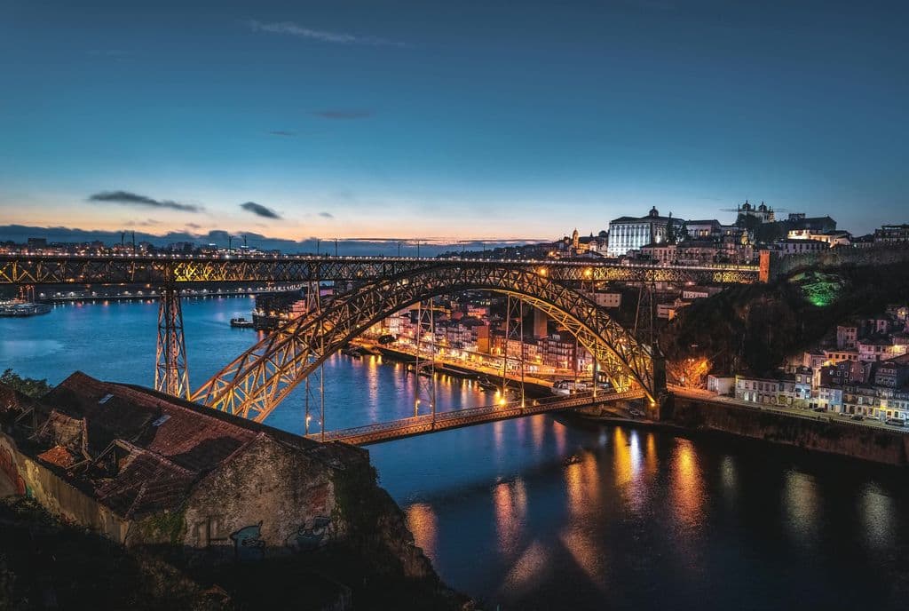 Dom Luís I Bridge lit above the Douro River in Porto, by Daniel Seßler