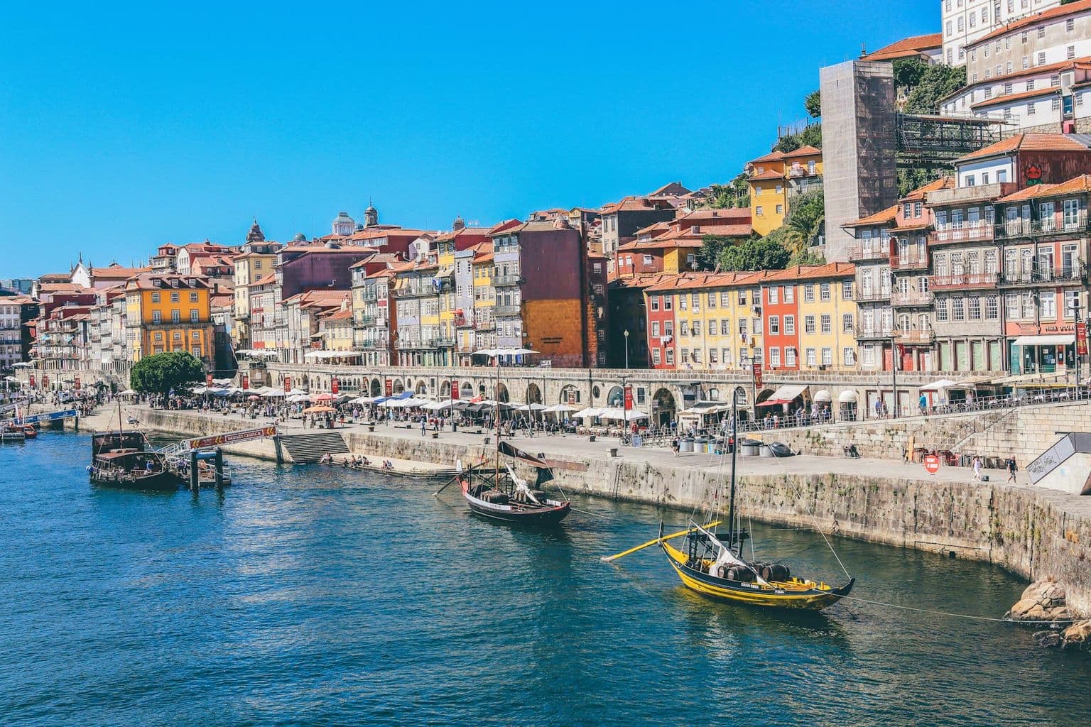 Boats on the Douro riverfront in Porto, by Nick Karvounis