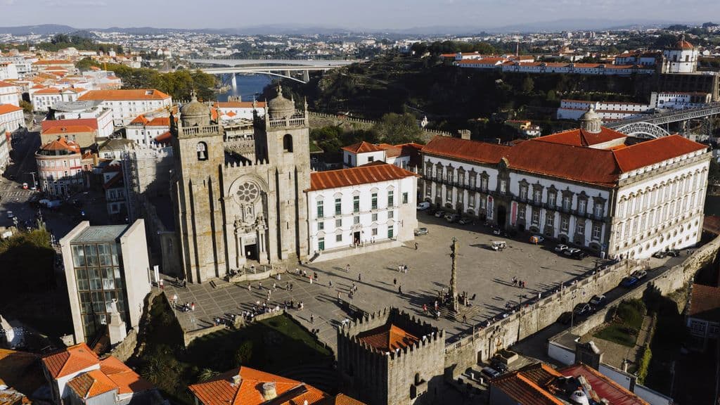 Porto Sé Cathedral above the old city at sunset, by K