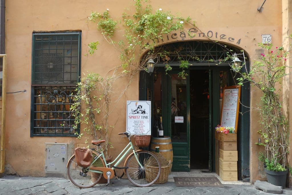 Antica Enoteca entrance with a bicycle in Rome, by mingche lee