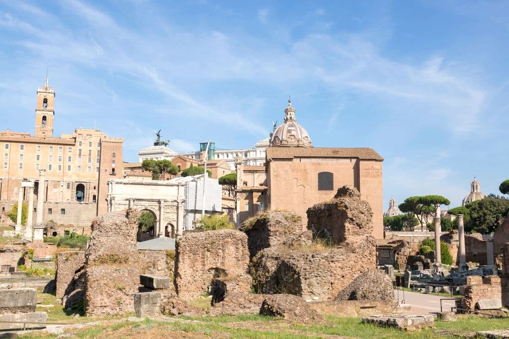Roman Forum ruins under a clear sky in Rome, by Valentin Ivantsov