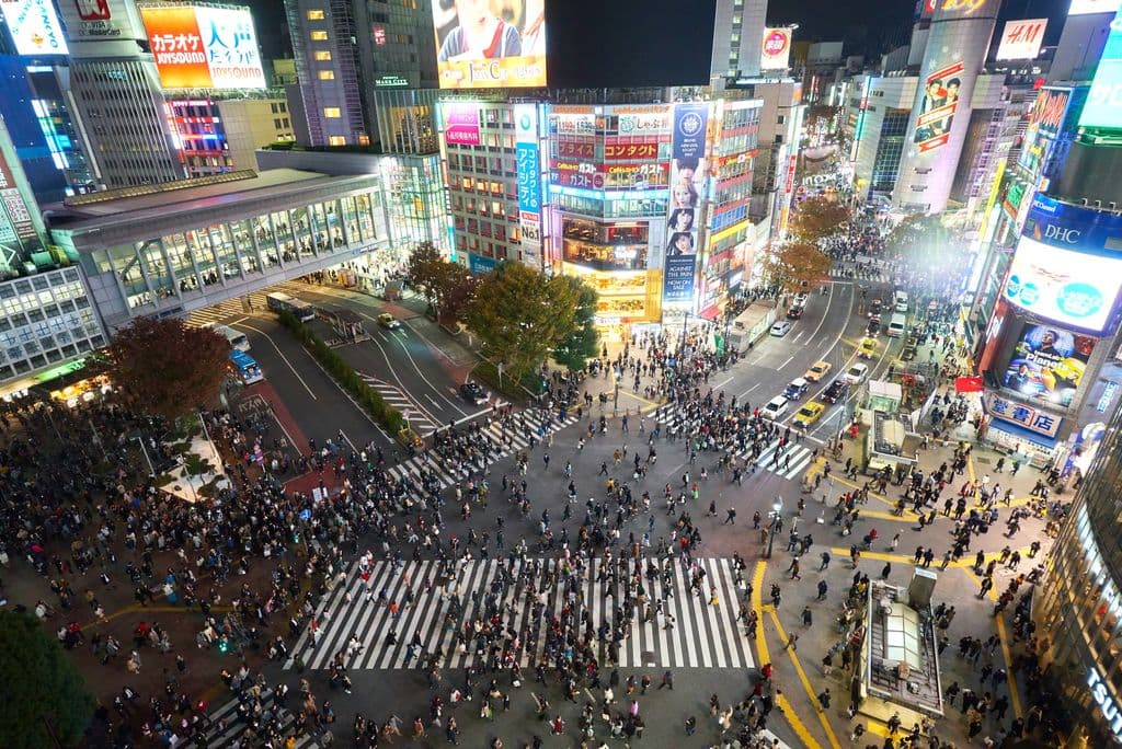 Overhead night view of Shibuya Crossing in Tokyo, by Timo Volz