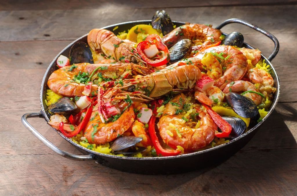 Seafood paella with prawns, mussels, and vegetables, by Marcelo Verfe