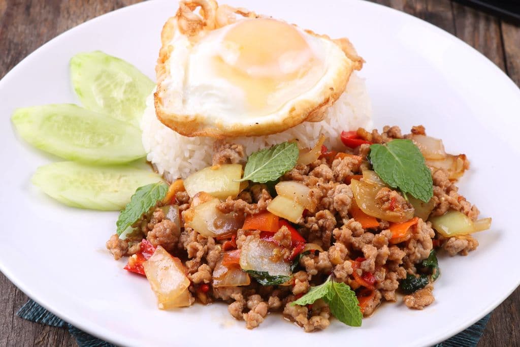 Pad kra pao basil pork with rice and fried egg, by UNDO KIM
