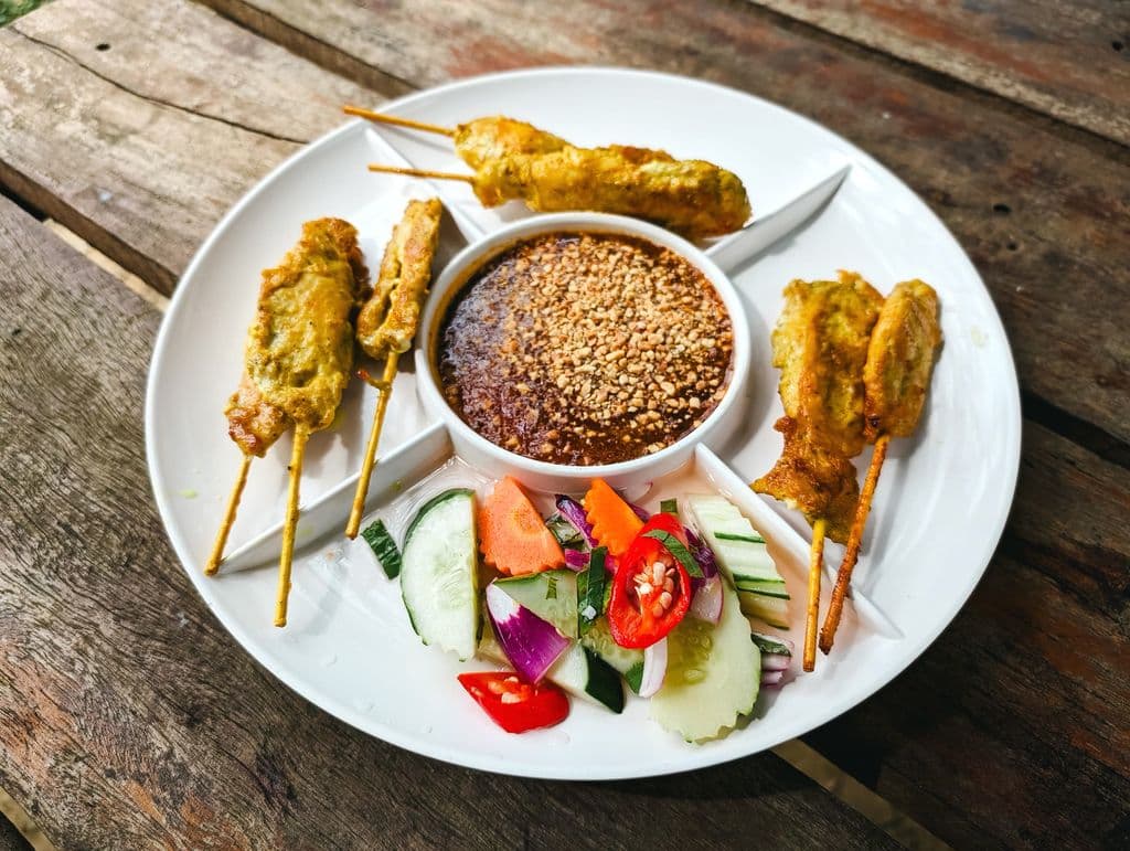Thai satay skewers with peanut sauce, by Markus Winkler