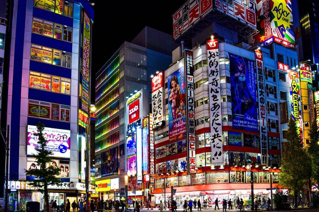 Neon-lit Akihabara street in Tokyo, by AXP Photography