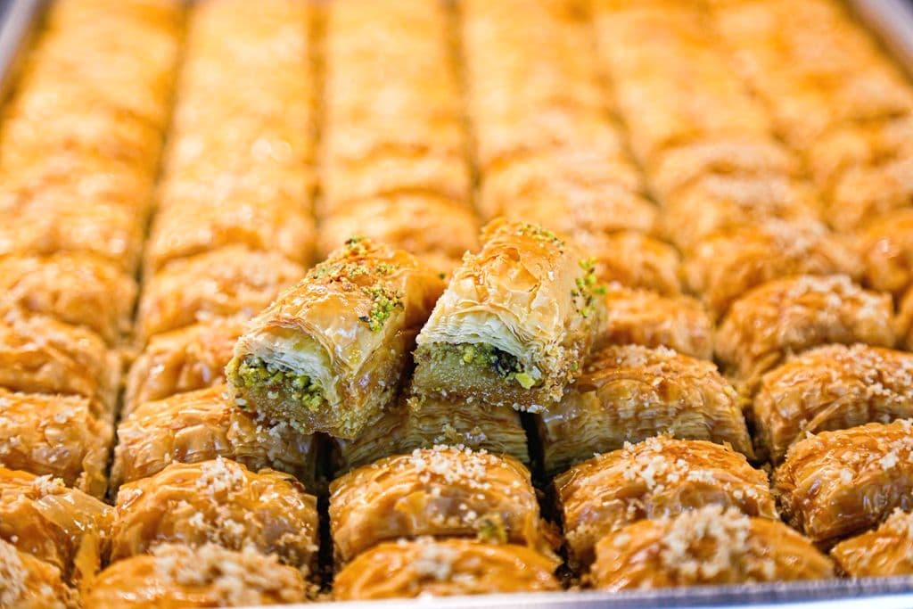 Tray of Turkish baklava with pistachio pieces, by Syed F Hashemi