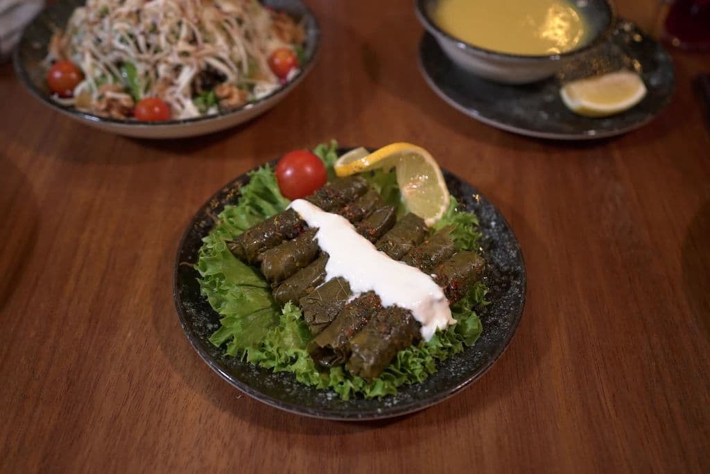 Stuffed vine leaves with yogurt and lemon, by Mohamed Olwy