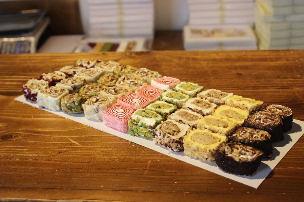 Assorted Turkish delight pieces on a display tray, by Recepcan Kazanc
