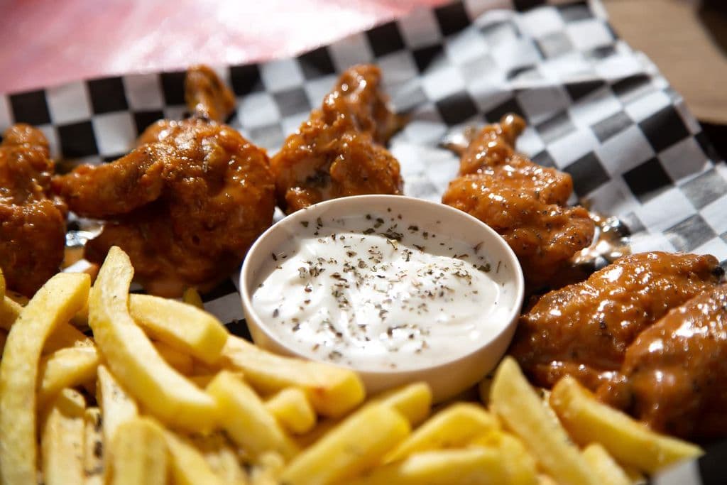 Buffalo wings with fries and creamy dip, by Zabdi Onan Caceres