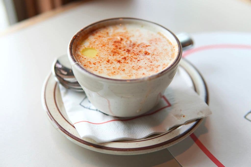 Cup of creamy clam chowder, by Brett Wharton